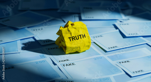 Crumpled yellow paper with TRUTH text among blue sheets labeled FAKE. Metaphor for finding clarity and authenticity amidst misinformation. Ideal for news media and digital ethics campaigns.