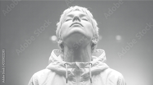 Konstfotografi Man looking up to sky with closed eyes, feeling peaceful and enlightened
