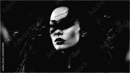 Fotografie Dramatic portrait of woman with long hair looking away in low light style