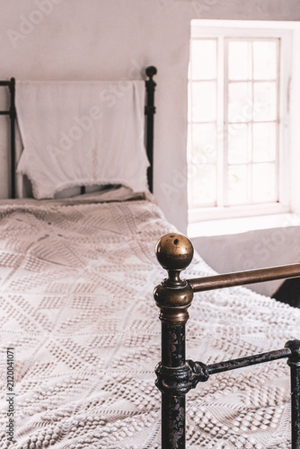 Photography Edwardian Cottage Bedstead In A Bedroom At Morwellham Quay, Devon