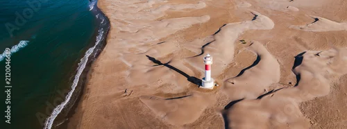 Panel kuchenny z motywem Aerial view of Fangar Lighthouse casting a long shadow across sand dunes on the Mediterranean coast in the Ebro Delta