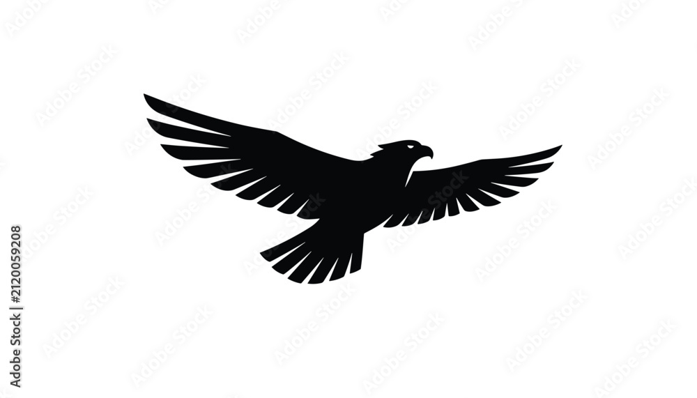 Fototapeta premium Powerful black silhouette of an eagle flying gracefully with outspread wings against a plain white background.