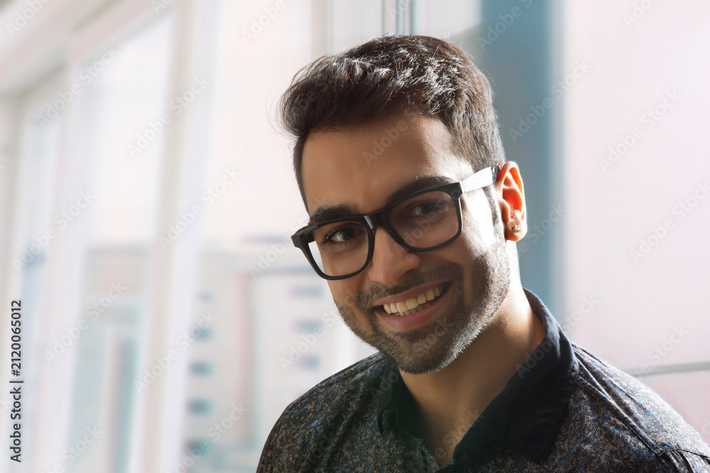 Fototapeta premium Close up portrait of man smiling,wearing eyeglasses