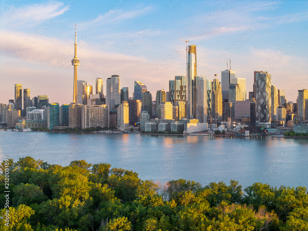 Fototapeta premium CN Tower and downtown Toronto glowing at sunrise