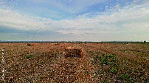 Drone Approaching a Straw Bale in a Harvested Wheat Field