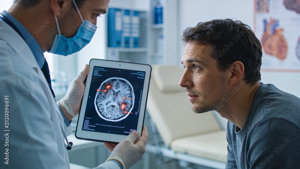 Obraz premium Masked physician explaining brain imaging results on digital tablet in contemporary neurological clinic examination room.