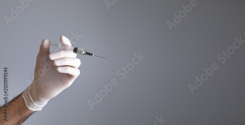 Doctor hand holding a syringe. Injection
