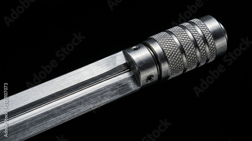Close Up of a Modern Fencing Foil Handle and Pommel with Textured Grip on Black Background Professional Sporting Equipment for Fencers Competition Gear and Combat Sports Training Accessory Detail