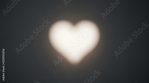A Glowing Heart: An ethereal, softly glowing heart shape emerges from the darkness, its gentle light a beacon of warmth and affection.