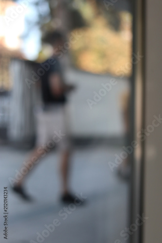 People entering and exiting the building.