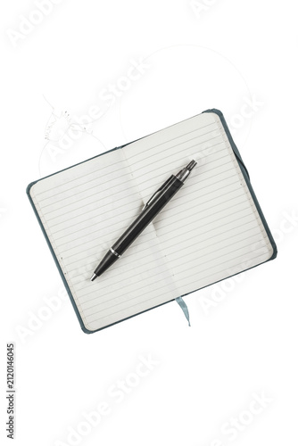 Foto Open notebook with black pen resting on lined pages