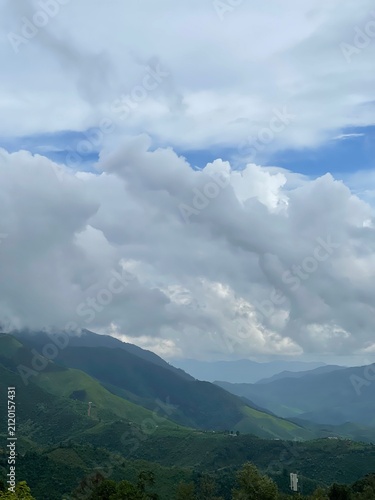 Canvas Print clouds over the mountains