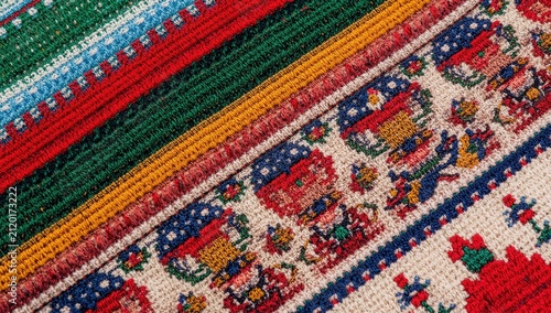 Detailed view of classic Ukrainian stitch design on cloth, cultural cross-stitch decoration, geometric folk textile backdrop.