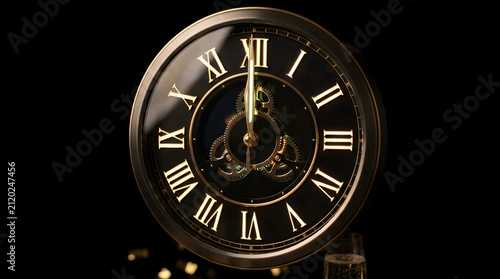 Vintage clock showing time with intricate details on black background  