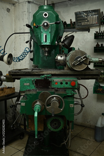 A professional metal drilling lathe in a production workshop.