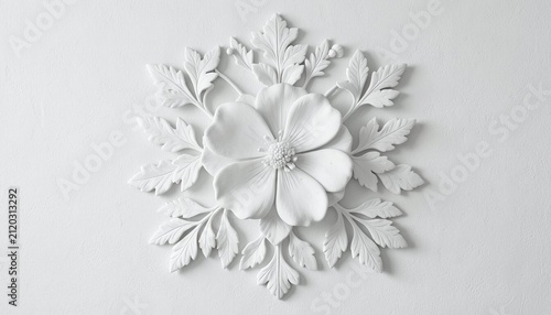 Elegant white plaster floral relief ornament with intricate carved leaves and petals on a plain background