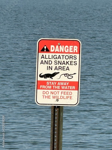 alligator and snake danger sign