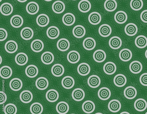 Grey geometric circular sunburst patterns with green background and white speckled dots. Suitable for design projects, print materials, and web backgrounds.