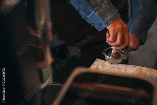 An experienced instructor guides students through the art of coffee making in a barista class, demonstrating brewing techniques and sharing tips for crafting the perfect cup
