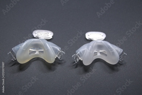 Old nasal CPAP mask or old nasal CPAP cradle cushion needs replacement for hygienic sleep apnea disorder therapy. Sleep apnea and sleep disorder with snoring stopped by respirator mask CPAP machine.