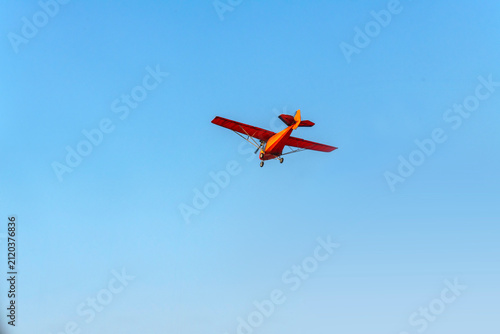 Photography Old classic propeller airplane turning on isolated blue sky