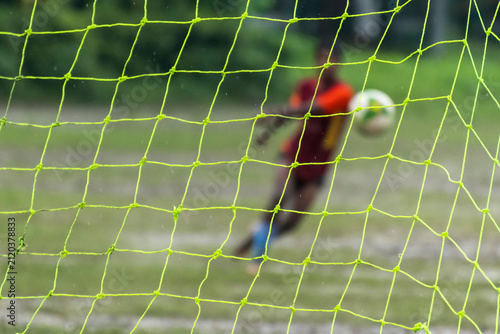 Football forward player shot ball toward goal
