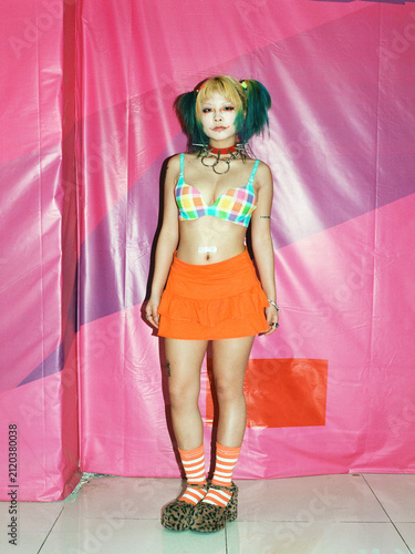 Punk Fashion Portrait of Woman Against Pink Background