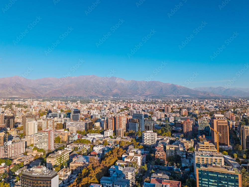 Fototapeta premium Aerial view of Santiago city skyline with Andes mountains in the background, Chile