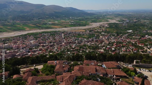 Albania, Berat, drone revealing the scenic historic village of Berat, ttoman houses with multiple windows built into the steep hills of the UNESCO city 