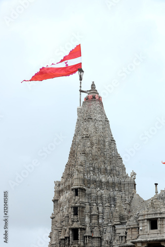 Majestic shikhara of Dwarkadhish Temple with religious flag in Dwarka, Gujarat