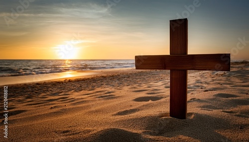 A Wooden Cross On A Sandy Beach During Sunset