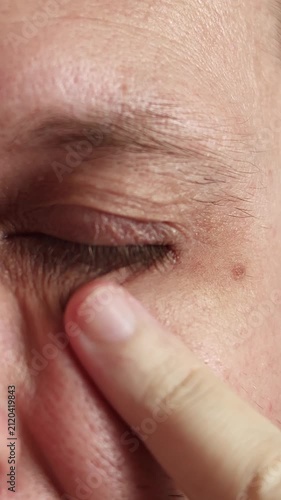 Crows Feet and Reduced Skin Elasticity Around Eye of Middle Aged Man. Close Up Showing Natural Aging, Anti Aging Skincare and Wellness Concept, Age-Related Skin Changes.
