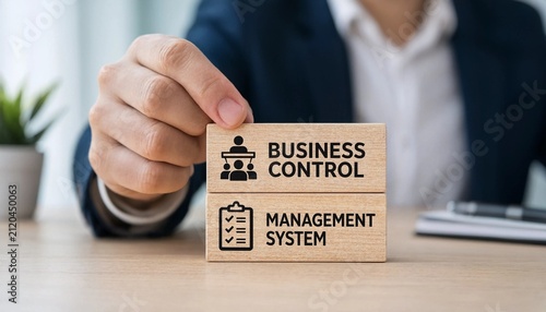Professional pointing at business control management system wooden blocks on office desk with blurred person