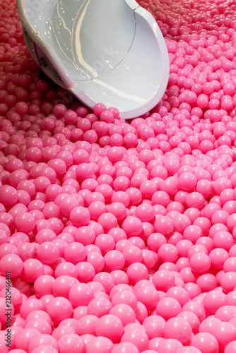Abstract background image with many pink balls and a slide.