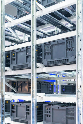 The machinery system for delivering goods in the material warehouse with a sliding mechanism, in a focus view on the sliding equipment.
