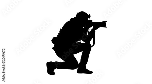 Obraz na płótnie Photographer kneeling with camera black silhouette photography
