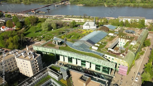 Aerial footage of Warsaw’s famous library rooftop garden, showing landscaped plants, glass structures, walking paths and eco-friendly city architecture.