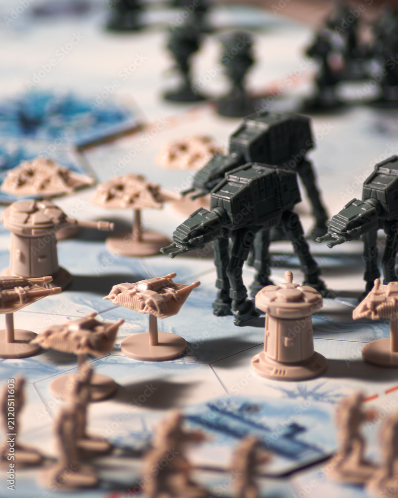 Fototapeta premium AT AT walkers advancing against Rebel forces during the Battle of Hoth on a detailed tabletop battlefield with defensive towers