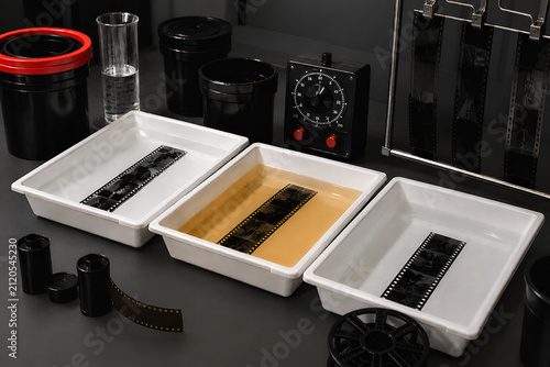 Black and White Film Developing Process in a Darkroom with Developing Trays