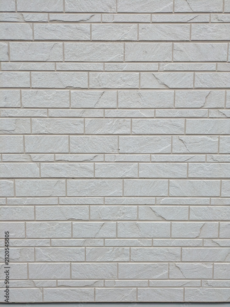 Fototapeta premium White stone textured siding wall background