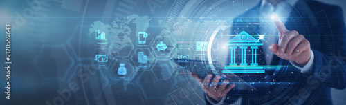 Financial manager pointing banking services network. Executive using tab analyzing digital transaction record and wealth management chart on hologram screen. Modern fintech and banking.