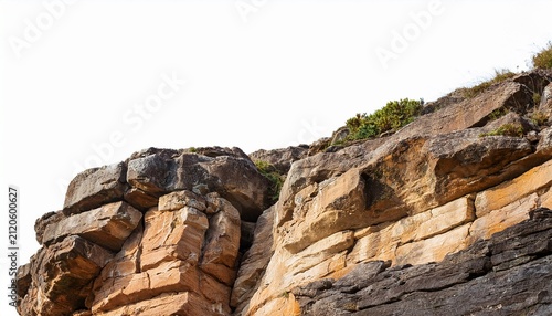 rocky cliff edge with textured surface isolated on a white background cutout background