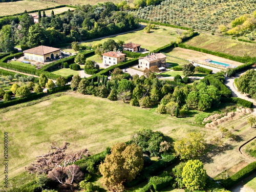 фотографія Drone view of countryside villa houses with pool in Italy for real estate backgr