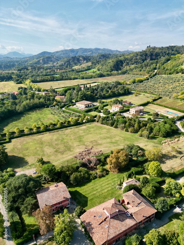 Fotografie Vertical aerial view of countryside village and hills in Italy for poster backgr