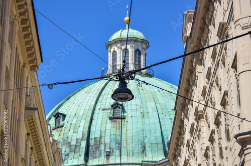 Street lamp at Vienna with St. Peter's church dome in background