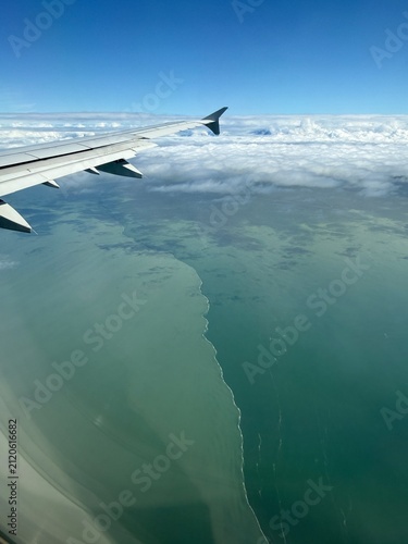 Картината върху платно brackish water meets marine water: aerial view of the sharp demarcation between