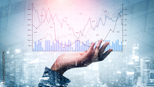Foto A hand reaches out towards a financial data chart, blending technology with urban landscape, representing key insights into business growth and investment trends