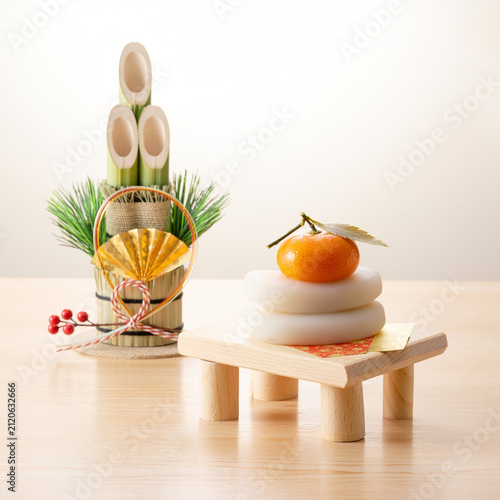 Traditional Japanese New Year decorations with kagamimochi rice cakes and kadomatsu
