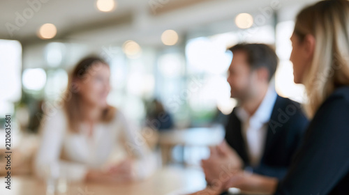 Immigration Consultant and Corporate Employee Reviewing Work Authorization Procedures in Blurred Modern Office