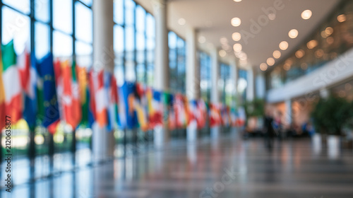 Blurred International Flags with Officials Meeting in Background Representing Global Diplomacy
